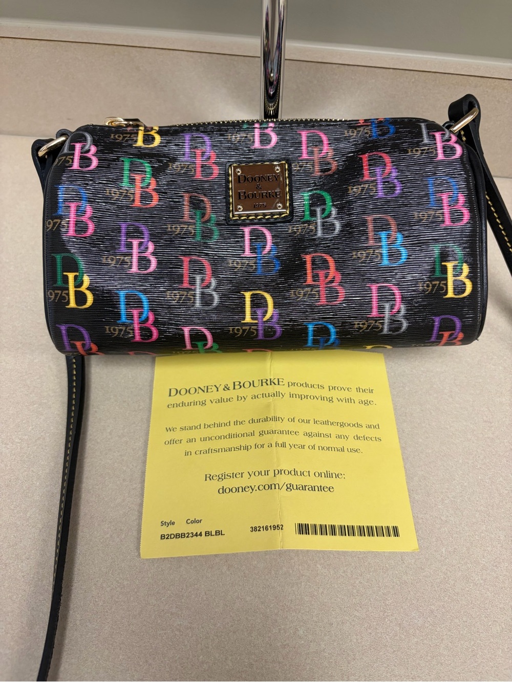 Dooney & Bourke 1975 DB Multicolor Logo Black Crossbody Bag Leather Trim